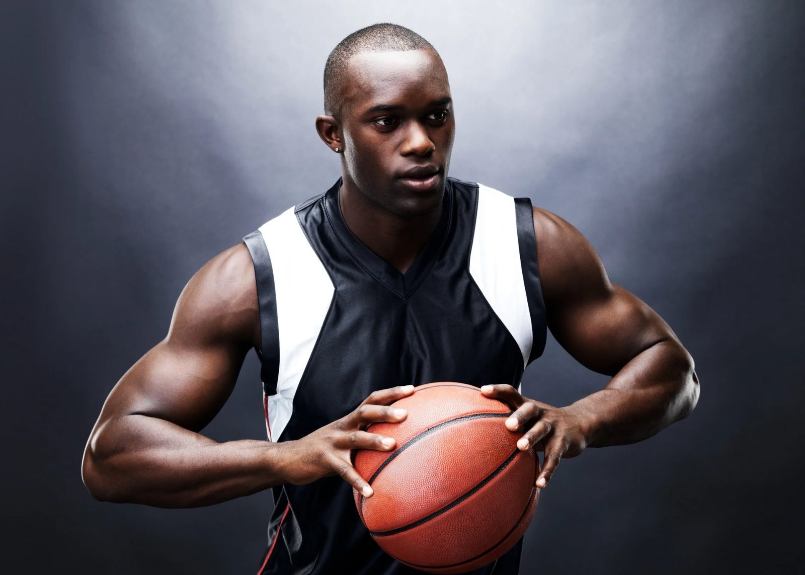 An athlete holding a basketball