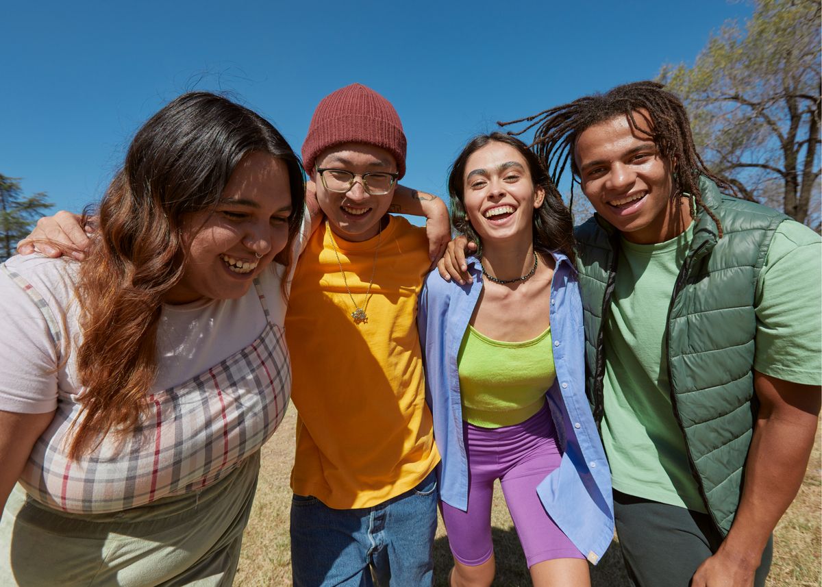 A group of teenagers standing together outdoors
